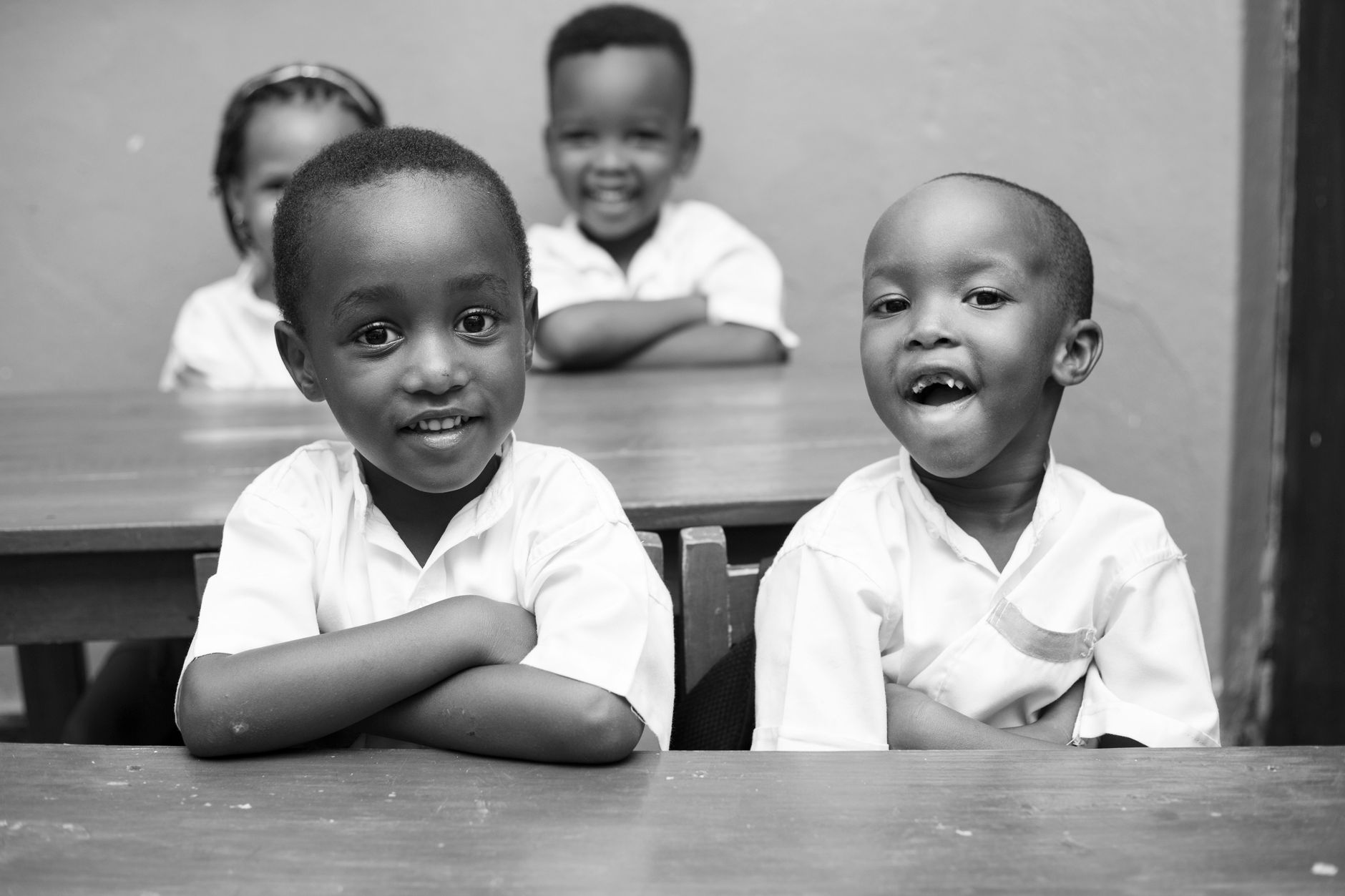 Children smiling in a bright classroom