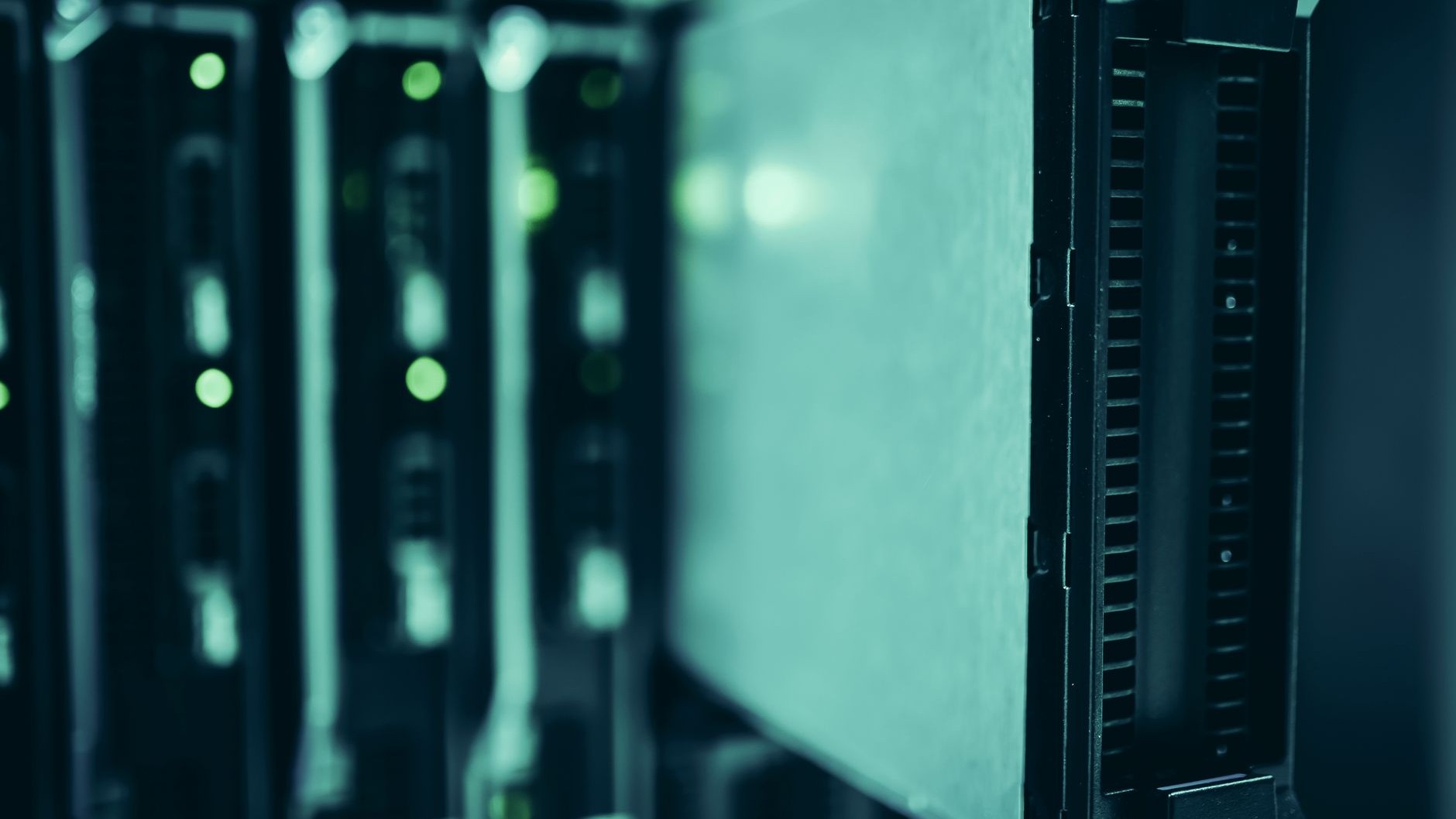 A row of server racks with green status lights in a data center